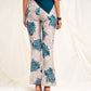 Printed high waist slim-fit trousers with slit at the hem